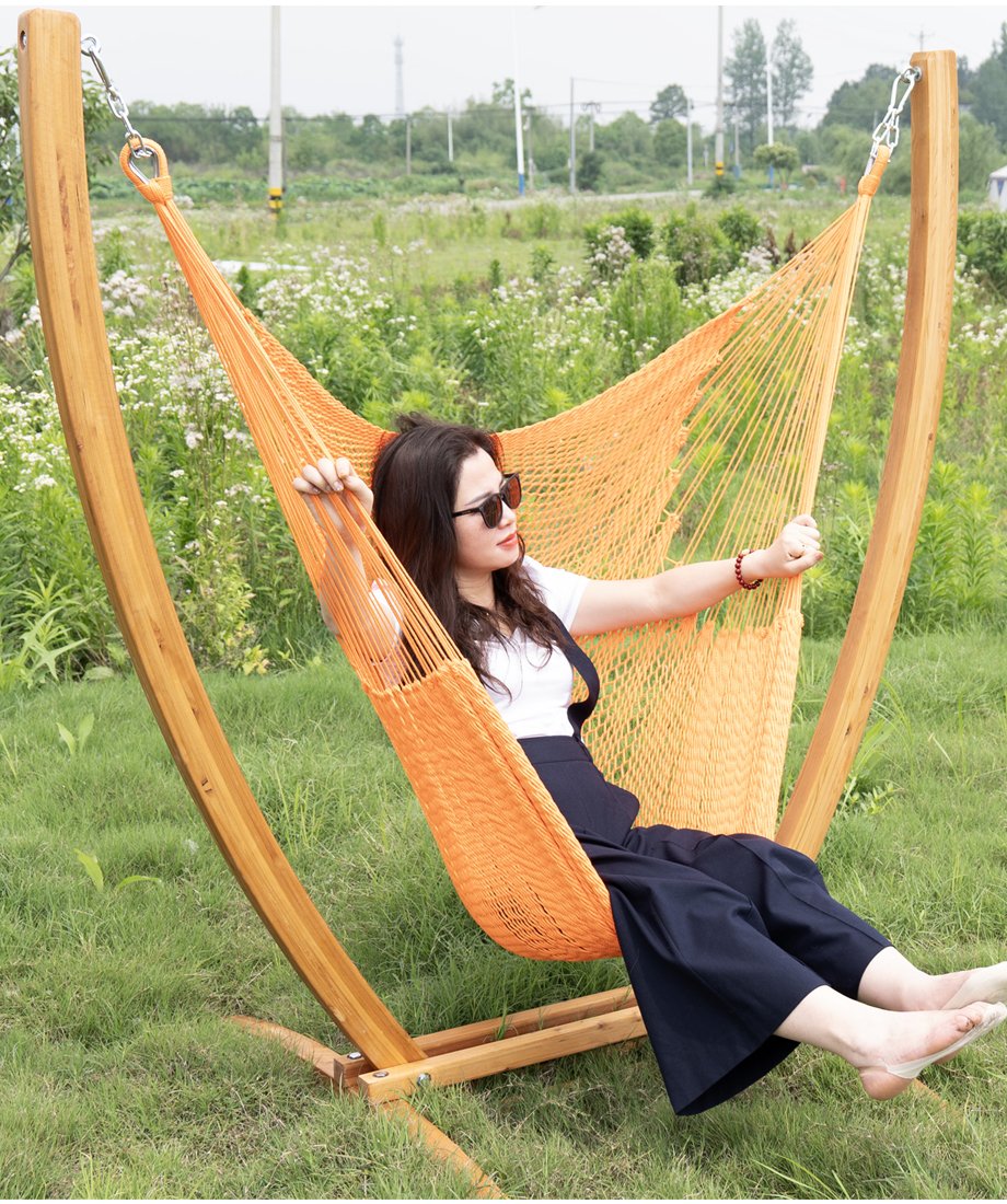 Display for orange caribbean hammock chair and wooden stand combo
